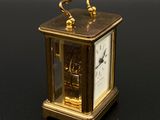 a small clock that is sitting on a table