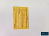 a sticker on the back of a white refrigerator