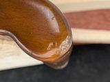 a wooden spoon sitting on top of an open book