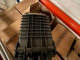a pile of boxes and boxes on the floor in a garage