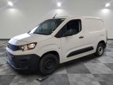 the white van is parked on a checkered floor in a room