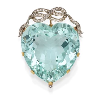 a close up of a heart shaped aquamarine and diamond broochle
