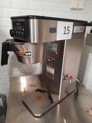 a coffee maker sitting on a counter in a kitchen