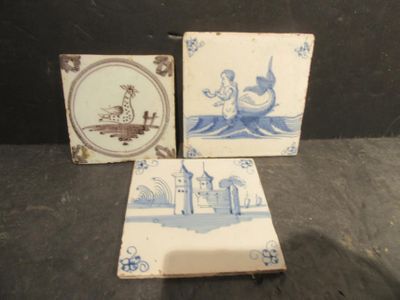 three tiles with a picture of a boat on them