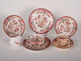 four different types of china plates and cups on a white surface