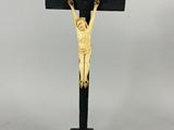 a black and gold crucif with jesus on the cross
