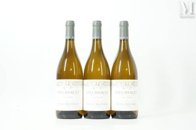three bottles of white wine sitting next to each other on a white surface