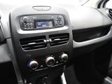 a dashboard of a car with a radio and a steering wheel