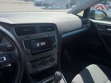 the interior of a car with a steering wheel and dashboard controls