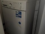 a washer and dryer in the corner of a room