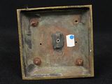 an image of a metal box with a blue dot on it