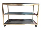 stainless steel and glass shelf with three shelves on casteors