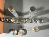 a lot of glass bottles that are sitting on a table