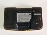 a close up of a cell phone on a white surface