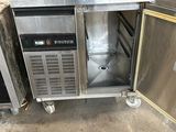a small stainless steel refrigerator with a door open