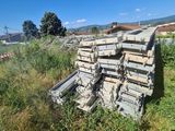 a pile of wood sitting in the middle of a field