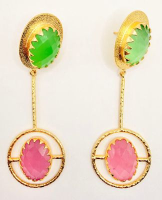 a pair of earrings with green and pink stones on them