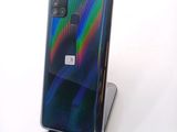 a close up of a phone on a stand on a white surface