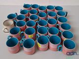 a lot of coffee cups that are sitting on the table