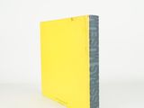a yellow book sitting on top of a white table