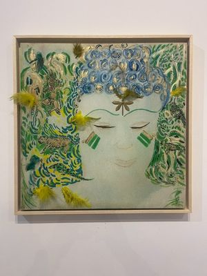 painting of a woman ' s face with feathers and feathers in her hair