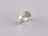 a silver ring with a heart and a cross on it