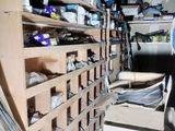 a room filled with lots of boxes and shelves