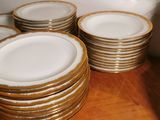 a lot of plates that are stacked on a table