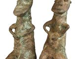 pair of bronze figurines of a man and a woman