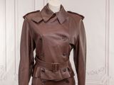 a woman ' s brown leather jacket on a mannequin mannequin mannequin mannequin mannequin mannequin mannequin manne