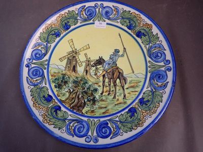 a blue and yellow plate with a picture of a man on a horse