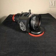 a camera that is sitting on a black surface