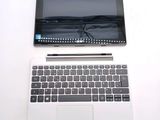 a laptop and a tablet on a white table