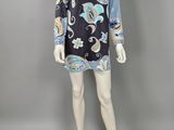 a mannequin mannequin wearing a black and blue paisley print dress