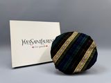 a picture of a black and blue tie and a box