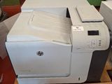 two printers sitting on a pallet in a room