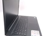 a black laptop with a black keyboard on a white surface