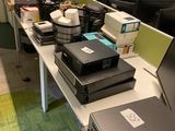 many computers on the desks in this office