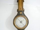 a clock hanging on the wall with an eagle on it