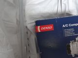 a box of a compressor sitting on a bed
