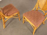 pair of vintage rattan chairs with cushions