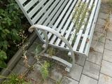 a bench that is sitting on the side of the road