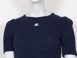 the mannequin is wearing a blue top with a white cat on it ' s chest