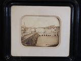 a black and white photo of a bridge over a river