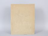 an old book sitting on top of a table next to a white wall