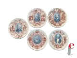 four plates with a picture of a man and a woman on them