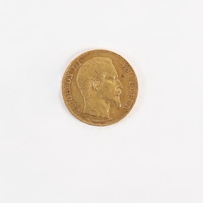 une pièce d'or sur laquelle figure l'image d'un homme