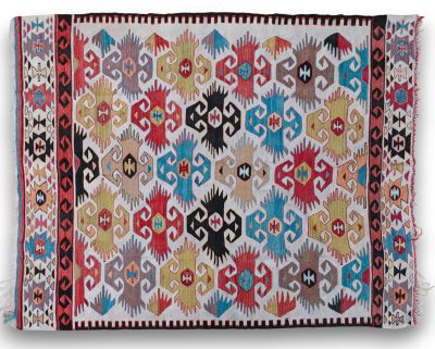 a multicolored rug on a white background
