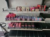 a lot of lipsticks on the shelves in the store