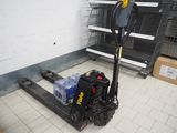 a forklift truck with a pallet in a warehouse